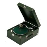 A 'His Master's Voice' gramophone in a green case.