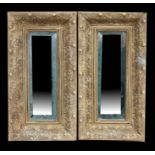 A pair of gilt framed bevelled edge wall mirrors, 26cms (10.25ins) wide (2).