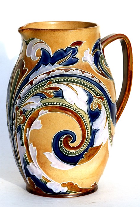 A late 19th Doulton Lambeth Mark V Marshall Design jug decorated with stylised flowers with