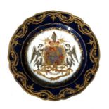 A 19th century French Armorial plate with gilt highlights on a cobalt blue ground, 24cms (9.5ins)