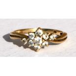 A 9ct gold cubic zirconia cluster ring, approx UK size 'P'.