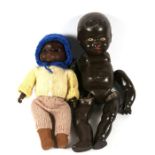 An Armand Marseilles black bisque headed doll, 32cms (11.75ins) high; together with a black