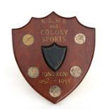 A Royal Electrical & Mechanical Engineers mahogany sports shield trophy on an easel stand from