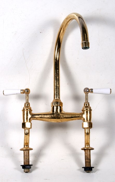 A set of brass mixer taps.