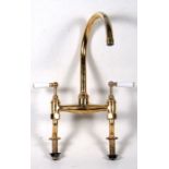 A set of brass mixer taps.