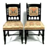 A pair of Victorian ebonised Goodwin style chairs with upholstered seats & backs, on ring turned