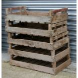 A group of five wooden apple crates.