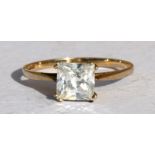 A 9ct gold dress ring set with a large square cut clear stone, approx UK size 'N'.