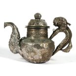An Eastern (Possibly Tibetan) white metal teapot with lion handle, 15cms (6ins) high.