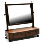 A 19th century mahogany bow fronted toilet mirror with two short drawers, on bun feet, 52cms (20.