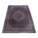 A Persian Mood Birjand handmade woollen carpet with allover Herati design and central medallion,