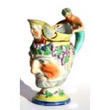 An early 19th century Pearlware or Prattware Bacchus jug with merman figural handle, 21cms 98.25ins)
