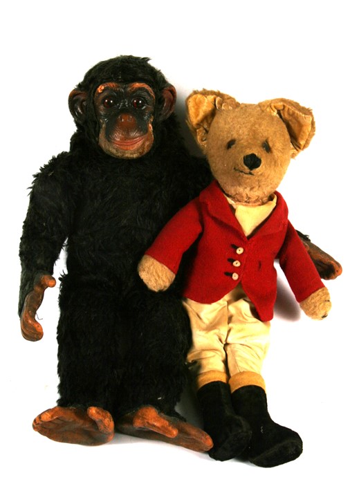 A vintage plush Huntsman Fox, 41cms (16ins) high; together with a plush Monkey, 41cms (16ins)