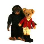 A vintage plush Huntsman Fox, 41cms (16ins) high; together with a plush Monkey, 41cms (16ins)