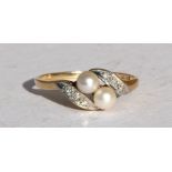 A 9ct gold pearl & diamond crossover ring, approx UK size 'M'.