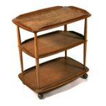 A blonde Ercol three-tier hostess trolley, 70cms (27.5ins) wide.