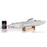 A scratch built wooden model of the WW2 German U Boat submarine U-31 on its wooden stand. The