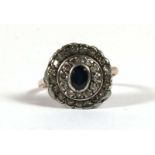 An early 20th century 18ct gold diamond and sapphire cluster ring, approx UK size 'S', 4g.