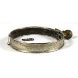 A Victorian silver plated leather lined dog collar with etched foliate design and brass padlock with