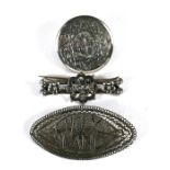 Three silver brooches, to include a filigree 'Holy Land' brooch (3).