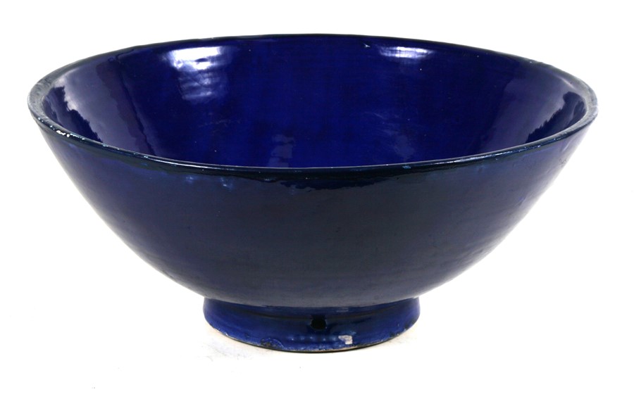 A large blue glazed terracotta bowl, 36cms (14.25ins) diameter.