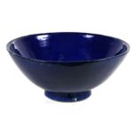 A large blue glazed terracotta bowl, 36cms (14.25ins) diameter.