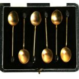 A cased set of Goldsmith's & Silversmith's enamel coffee bean spoons.