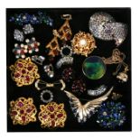A quantity of costume jewellery brooches, earrings and buttons.