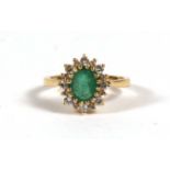 An 18ct gold diamond & emerald cluster ring, approx UK size 'L'.