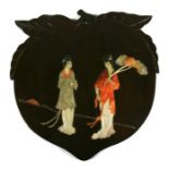 A Chinese panel in the form of a peach, inlaid with soapstone depicting two robed ladies, 31cms (