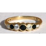 A 9ct gold sapphire & cubic zirconia set ring, approx UK size 'L'.