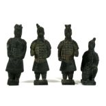 A group of four Chinese Terracotta Army warrior figures, the largest 16cms (6.25ins) high.
