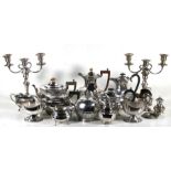 A pair of silver plated candelabra; together with a quantity of silver plated items including tea