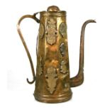 A large Eastern brass coffee pot, 47cms (18.5ins) high.