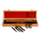 A boxed shotgun cleaning kit together with rifle pull throughs etc