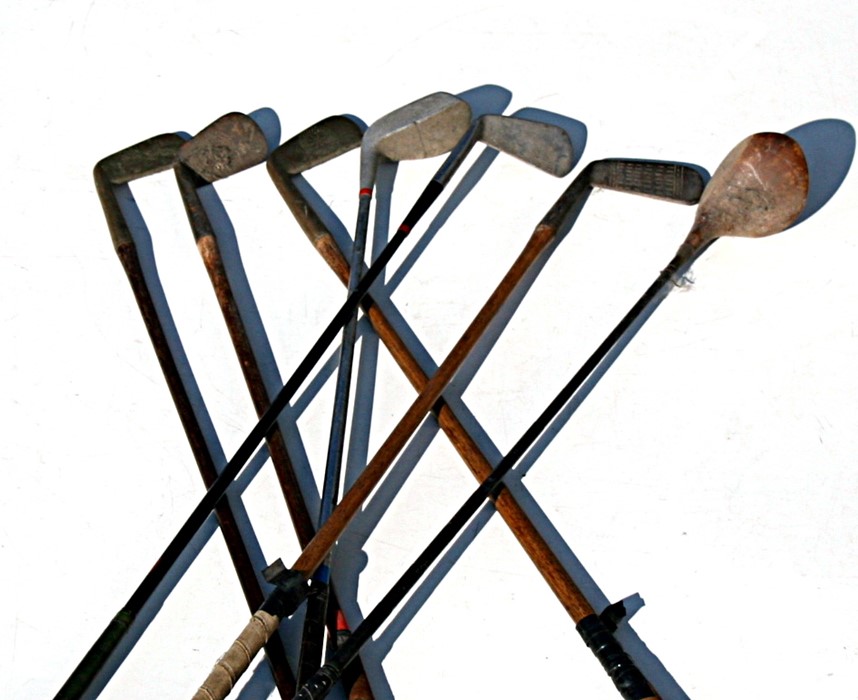 A group of hickory shafted and other golf clubs.