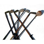 A group of hickory shafted and other golf clubs.