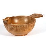 A Scandinavian chip carved bowl in the form of a stylised bird, 24cms (9.5ins) wide.