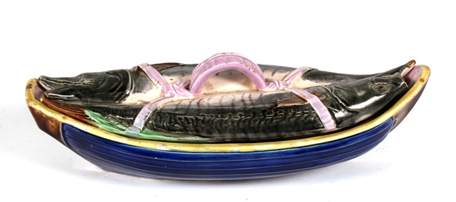 A 19th century majolica sardine dish and cover, 32cms (12.5ins) wide.Condition Report Loss to