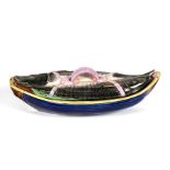 A 19th century majolica sardine dish and cover, 32cms (12.5ins) wide.Condition Report Loss to