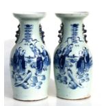 A pair of Chinese blue & white vases decorated with scholars holding scrolls, 43cms 916.75ins)
