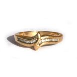 A 9ct gold dress ring set with baguette diamonds, approx UK size 'M'.