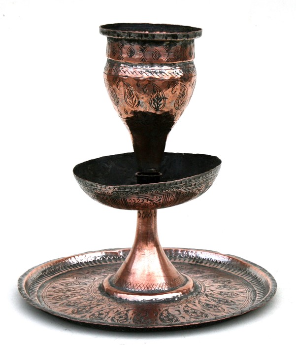 An Islamic silver on copper table centrepiece engraved with leaves, 28cms (11ins) high.