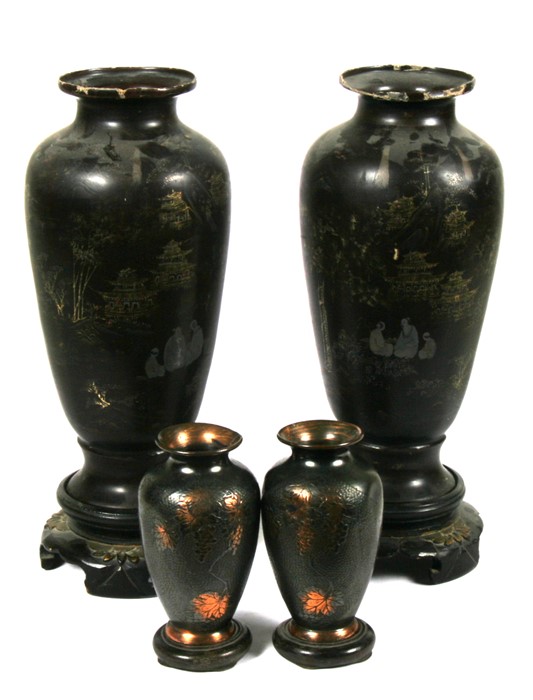 A pair of Chinese Foochow lacquer vases decorated with figures in a landscape, 31cms (12.25ins) high