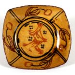 David Eeles (1933-2015) a slipware dish with impressed mark to underside, 19cms (7.5ins) diameter.