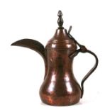A Turkish / Islamic copper dallah coffee pot, 24cms (9.5ins) high.