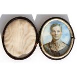 A cased portrait miniature of a WWI soldier, 6.5 by 8cms (2.75 by 3.1ins).