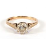 A 9ct gold dress ring set with a large central white stone, approx UK size 'M'.