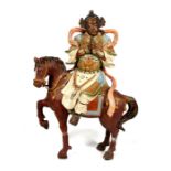 A Chinese pottery group depicting a horse and rider, 74cms (29ins) high (a/f).