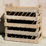 A group of five wooden apple crates.